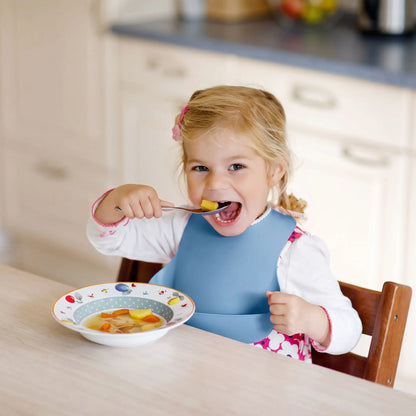 Bavoir bébé bleu fillette qui mange